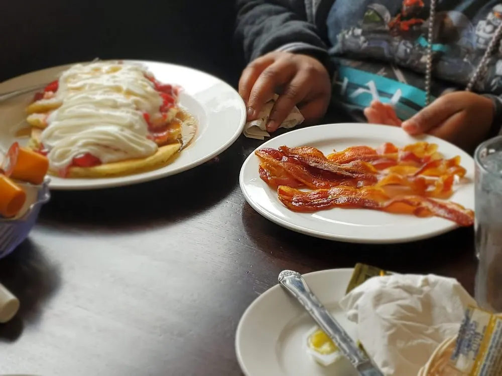 Strawberry Pancakes and a Side of Bacon Strips